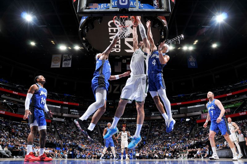 ORLANDO, FL - APRIL 14: Brook Lopez #11 of the Milwaukee Bucks drives to the basket during the game against the Orlando Magic on April 14, 2024 at Kia Center in Orlando, Florida. NOTE TO USER: User expressly acknowledges and agrees that, by downloading and or using this photograph, User is consenting to the terms and conditions of the Getty Images License Agreement. Mandatory Copyright Notice: Copyright 2024 NBAE (Photo by Fernando Medina/NBAE via Getty Images)