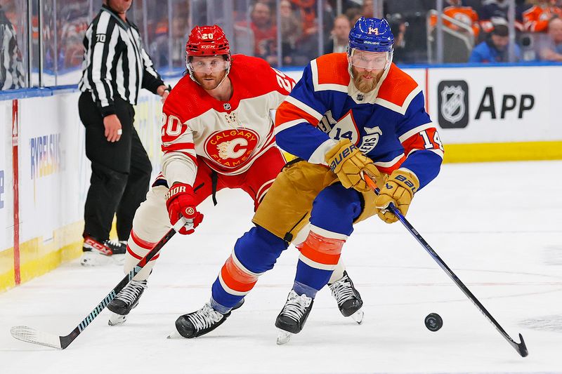 Feb 24, 2024; Edmonton, Alberta, CAN; Edmonton Oilers defensemen Mattias Ekholm (14) moves the puck in front of Calgary Flames forward Blake Coleman (20) during the second period at Rogers Place. Mandatory Credit: Perry Nelson-USA TODAY Sports