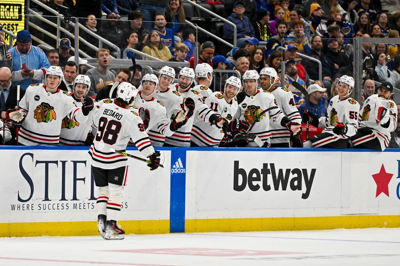 Dec 23, 2023; St. Louis, Missouri, USA;  Chicago Blackhawks center Connor Bedard (98) is congratulated by teammates after scoring against the St. Louis Blues during the first period at Enterprise Center. Mandatory Credit: Jeff Curry-USA TODAY Sports