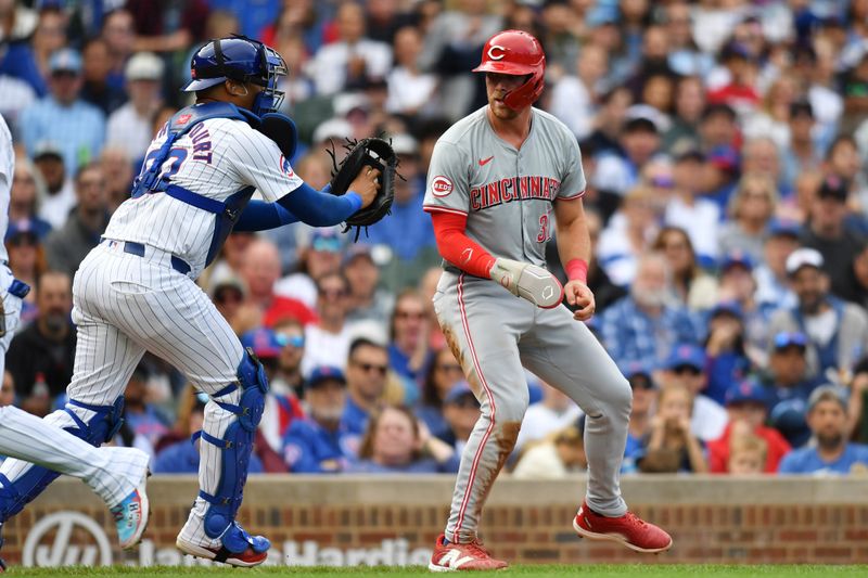 Sep 29, 2024; Chicago, Illinois, USA; Chicago Cubs catcher Christian Bethancourt (60) tags out Cincinnati Reds designated hitter Tyler Stephenson (37) while attempting to score during the fourth inning at Wrigley Field. Mandatory Credit: Patrick Gorski-Imagn Images