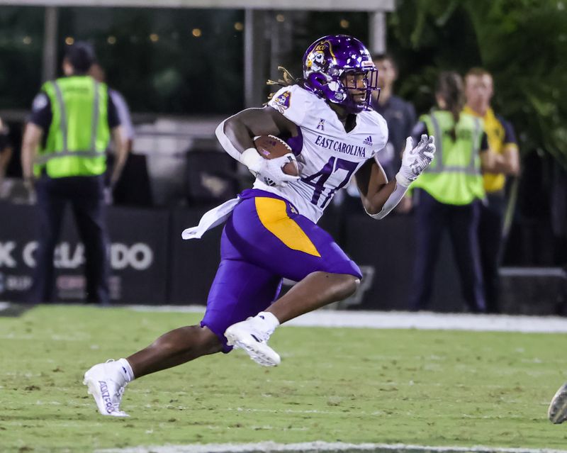 Oct 9, 2021; Orlando, Florida, USA; East Carolina Pirates running back Rahjai Harris (47) runs the ball during the second half against the UCF Knights at Bounce House. Mandatory Credit: Mike Watters-USA TODAY Sports