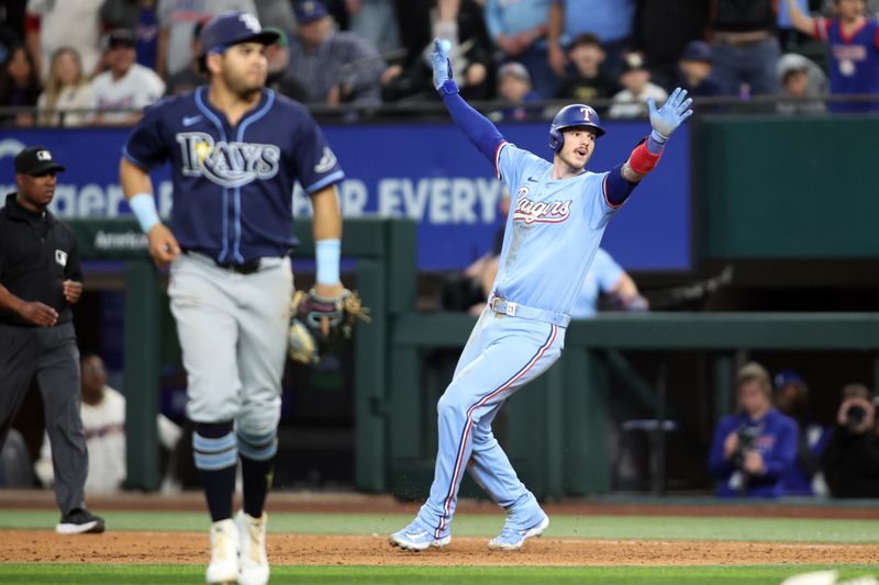 Apr 6, 2025; Arlington, Texas, USA; Texas Rangers catcher Jonah Heim (28) reacts after he singled in the winning run in the bottom of the ninth inning against the Tampa Bay Rays at Globe Life Field. Mandatory Credit: Tim Heitman-Imagn Images