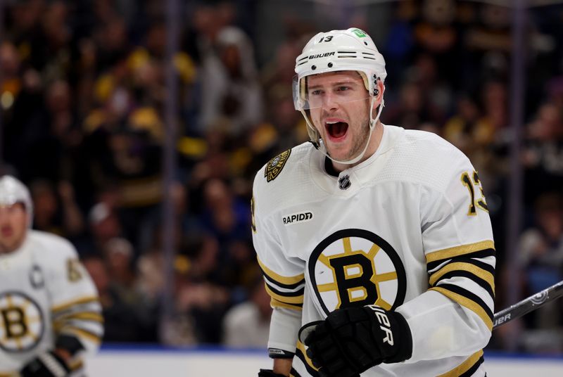 Dec 27, 2023; Buffalo, New York, USA;  Boston Bruins center Charlie Coyle (13) reacts after scoring a goal during the first period against the Buffalo Sabres at KeyBank Center. Mandatory Credit: Timothy T. Ludwig-USA TODAY Sports