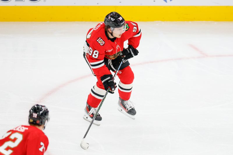 Oct 19, 2025; Chicago, Illinois, USA; Chicago Blackhawks center Connor Bedard (98) looks to shoot the puck against the Anaheim Ducks during the second period at United Center. Mandatory Credit: Kamil Krzaczynski-Imagn Images