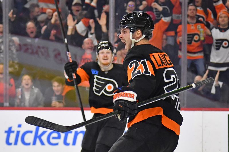 Mar 19, 2024; Philadelphia, Pennsylvania, USA; Philadelphia Flyers center Scott Laughton (21) celebrates his goal with right wing Owen Tippett (74) against the Toronto Maple Leafs during the third period at Wells Fargo Center. Mandatory Credit: Eric Hartline-USA TODAY Sports