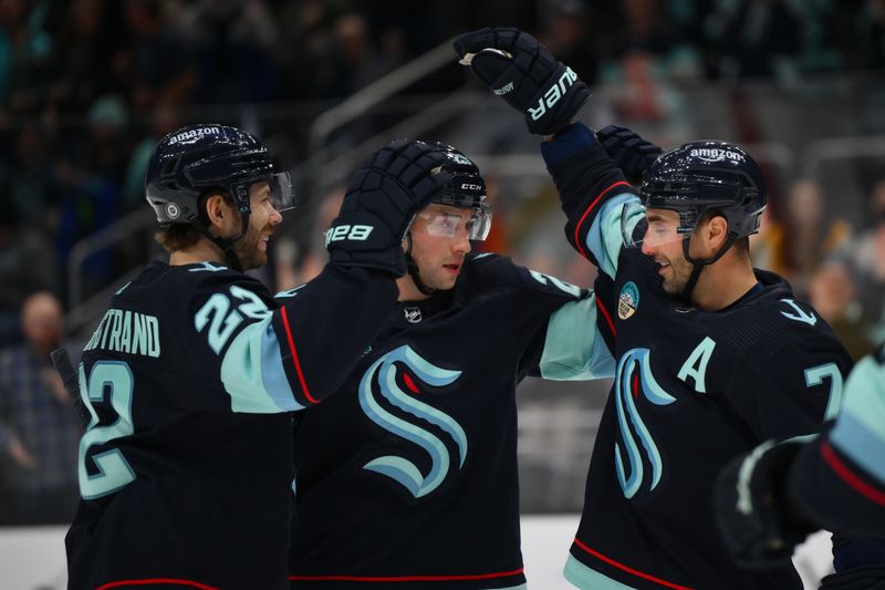 Jan 26, 2024; Seattle, Washington, USA; The Seattle Kraken celebrate after a goal scored by right wing Oliver Bjorkstrand (22) against the St. Louis Blues during the second period at Climate Pledge Arena. Mandatory Credit: Steven Bisig-USA TODAY Sports