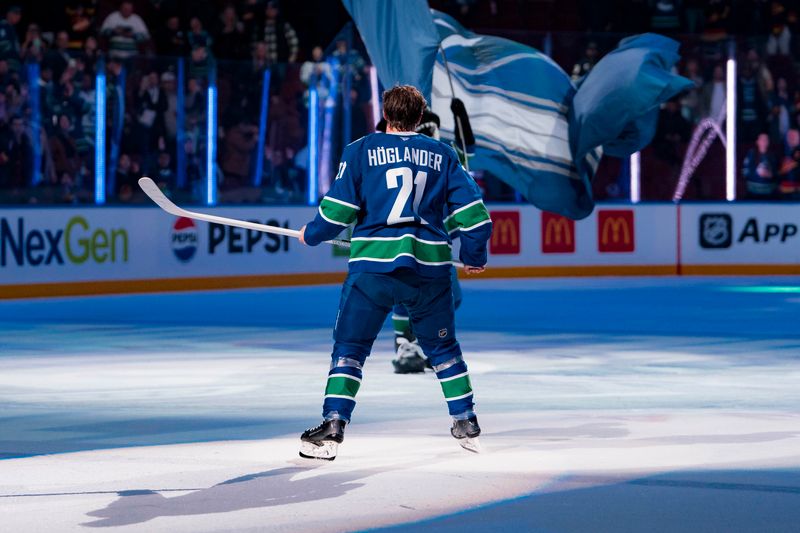 Mar 18, 2025; Vancouver, British Columbia, CAN; Vancouver Canucks forward Nils Hoglander (21) skates out as the game’s second star against the Winnipeg Jets at Rogers Arena. Mandatory Credit: Bob Frid-Imagn Images
