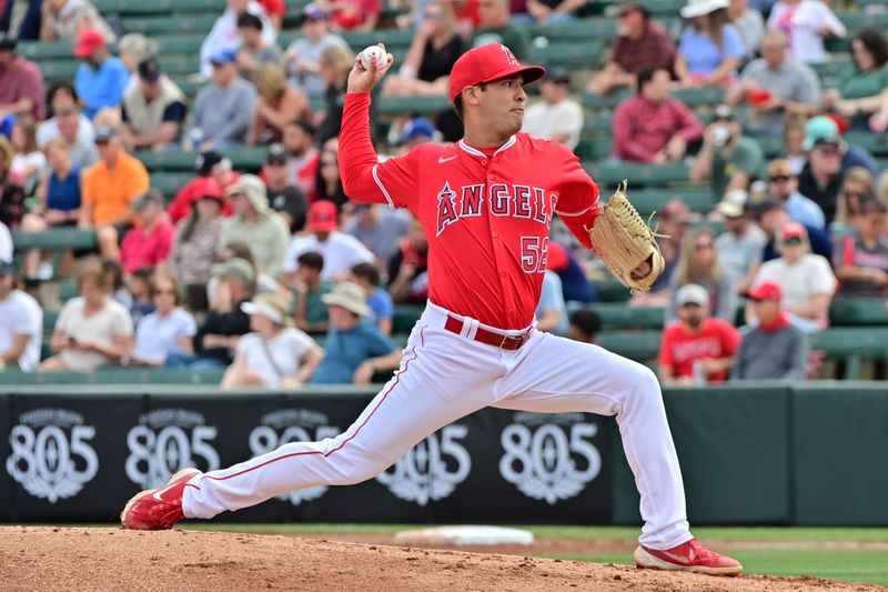 Mar 6, 2024; Tempe, Arizona, USA;  Los Angeles Angels pitcher Erik Martinez (52) throws in the first inning against the Oakland Athletics during a spring training game at Tempe Diablo Stadium. Mandatory Credit: Matt Kartozian-USA TODAY Sports