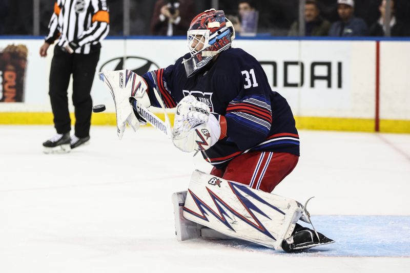 Oct 24, 2024; New York, New York, USA;  New York Rangers goaltender Igor Shesterkin (31) makes a save on a shot on goal attempt in the first period against the Florida Panthers at Madison Square Garden. Mandatory Credit: Wendell Cruz-Imagn Images