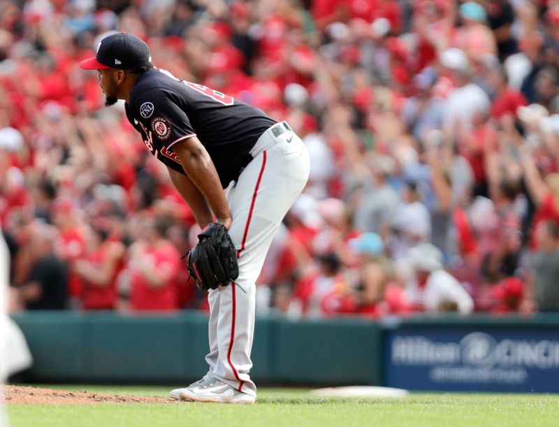 Aug 5, 2023; Cincinnati, Ohio, USA; Washington Nationals starting pitcher Joan Adon (60) reacts after giving up a three-run home run against the Cincinnati Reds during the sixth inning at Great American Ball Park. Mandatory Credit: David Kohl-USA TODAY Sports