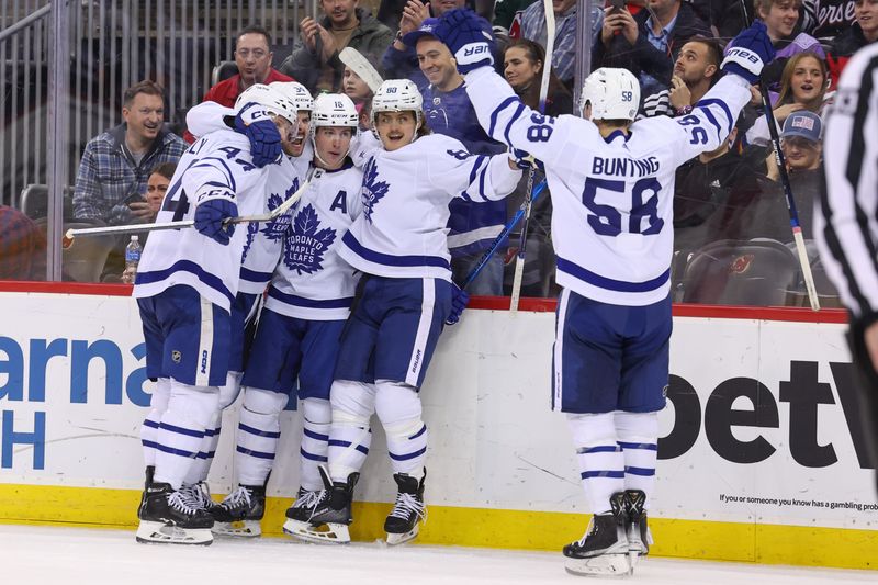 Mar 7, 2023; Newark, New Jersey, USA; Toronto Maple Leafs center Auston Matthews (34) celebrates his goal against the New Jersey Devils during the third period at Prudential Center. Mandatory Credit: Ed Mulholland-USA TODAY Sports