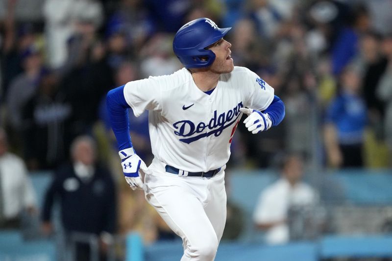 Jun 15, 2023; Los Angeles, California, USA; Los Angeles Dodgers first baseman Freddie Freeman (5) reacts after hitting a walk-off single in the 11th inning against the Chicago White Sox at Dodger Stadium. Mandatory Credit: Kirby Lee-USA TODAY Sports