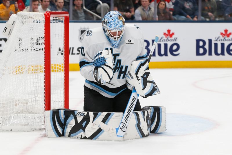 Mar 7, 2026; Columbus, Ohio, USA; Utah Mammoth goalie Karel Vejmelka (70) makes a save against the Columbus Blue Jackets during the second period at Nationwide Arena. Mandatory Credit: Russell LaBounty-Imagn Images
