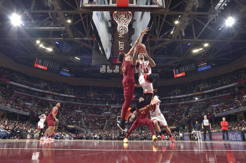 CLEVELAND, OH - FEBRUARY 14: DeMar DeRozan #11 of the Chicago Bulls drives to the basket during the game against the Cleveland Cavaliers on February 14, 2024 at Rocket Mortgage FieldHouse in Cleveland, Ohio. NOTE TO USER: User expressly acknowledges and agrees that, by downloading and/or using this Photograph, user is consenting to the terms and conditions of the Getty Images License Agreement. Mandatory Copyright Notice: Copyright 2024 NBAE (Photo by David Liam Kyle/NBAE via Getty Images)