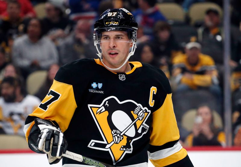 Oct 9, 2024; Pittsburgh, Pennsylvania, USA;  Pittsburgh Penguins center Sidney Crosby (87) looks on against the New York Rangers during the third period at PPG Paints Arena. Mandatory Credit: Charles LeClaire-Imagn Images