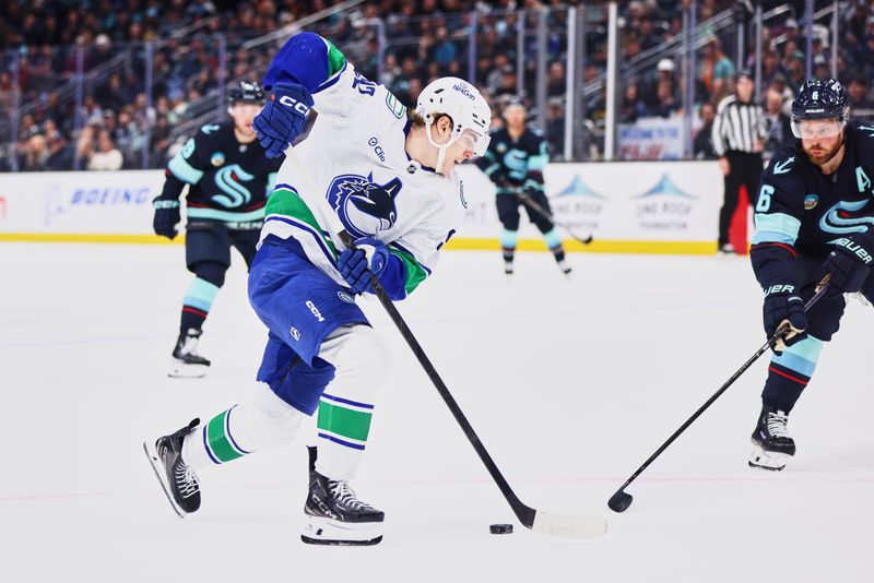 Feb 28, 2026; Seattle, Washington, USA; Vancouver Canucks left wing Liam Ohgren (92) controls the puck during the first period against the Seattle Kraken at Climate Pledge Arena. Mandatory Credit: Blake Dahlin-Imagn Images
