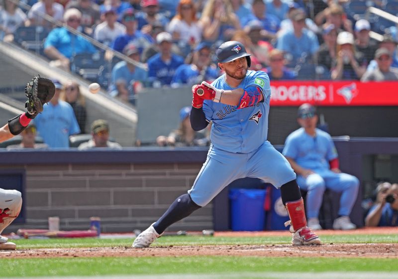 Aug 25, 2024; Toronto, Ontario, CAN; Toronto Blue Jays catcher Alejandro Kirk (30) draws a walk and scores a run against the Los Angeles Angels during the third inning at Rogers Centre. Mandatory Credit: Nick Turchiaro-USA TODAY Sports