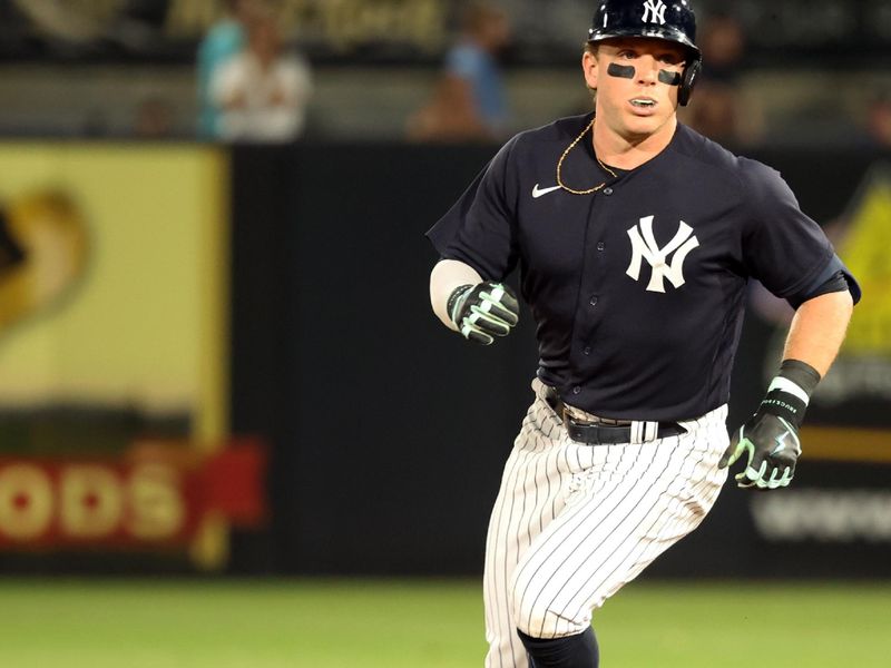 Mar 3, 2023; Tampa, Florida, USA;  New York Yankees center fielder Harrison Bader (22) doubles during the second inning against the Detroit Tigers at George M. Steinbrenner Field. Mandatory Credit: Kim Klement-USA TODAY Sports