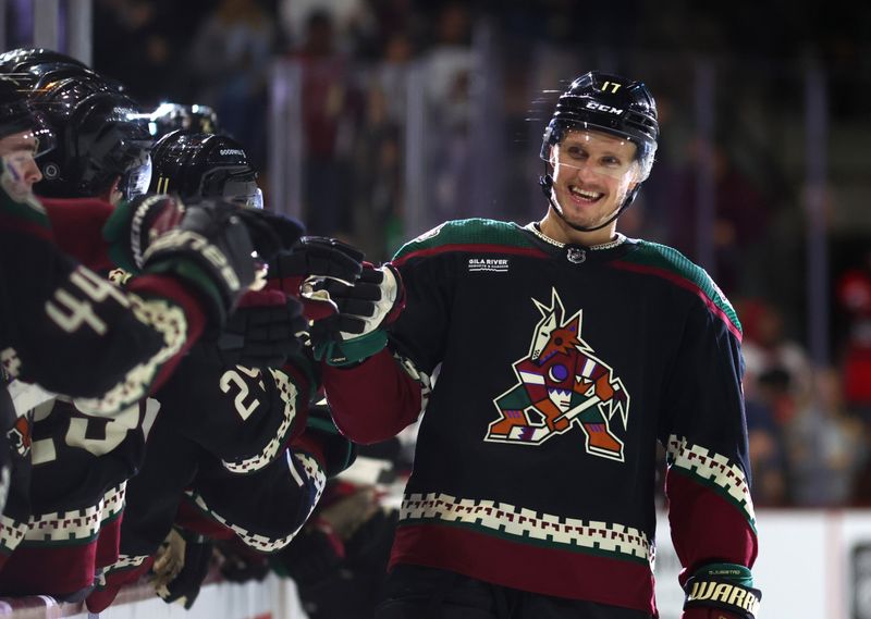 Jan 17, 2023; Tempe, Arizona, USA; Arizona Coyotes center Nick Bjugstad (17) celebrates with teammates after scoring a goal in a shootout against the Detroit Red Wings at Mullett Arena. Mandatory Credit: Mark J. Rebilas-USA TODAY Sports