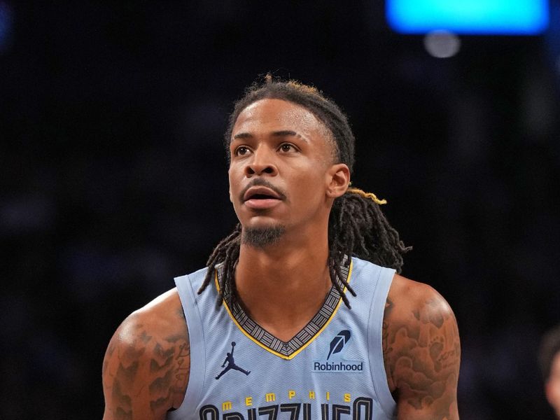 BROOKLYN, NY - NOVEMBER 4: Ja Morant #12 of the Memphis Grizzlies shoots a free throw during the game against the Brooklyn Nets  on November 4, 2024 at Barclays Center in Brooklyn, New York. NOTE TO USER: User expressly acknowledges and agrees that, by downloading and or using this Photograph, user is consenting to the terms and conditions of the Getty Images License Agreement. Mandatory Copyright Notice: Copyright 2024 NBAE (Photo by Jesse D. Garrabrant/NBAE via Getty Images)