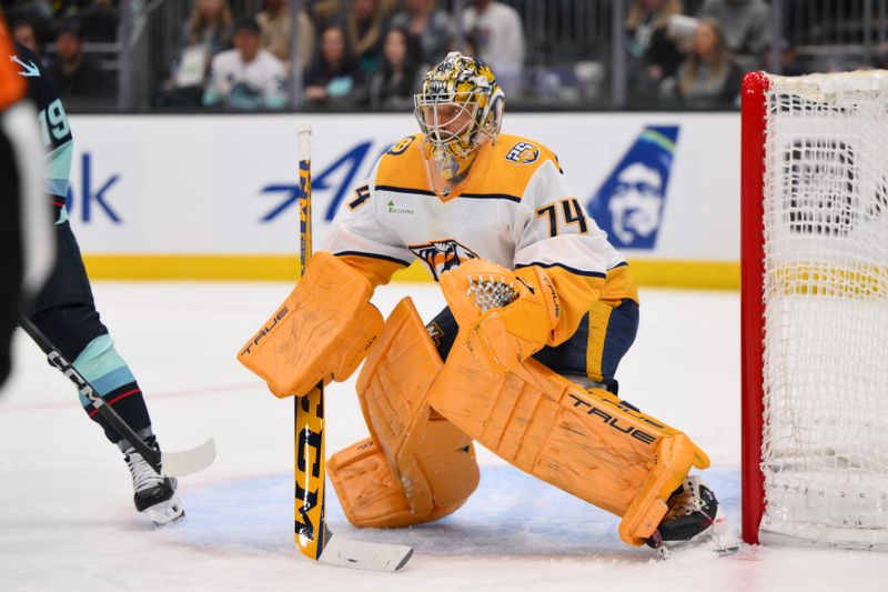 Mar 16, 2024; Seattle, Washington, USA; Nashville Predators goaltender Juuse Saros (74) defends the goal against the Seattle Kraken during the second period at Climate Pledge Arena. Mandatory Credit: Steven Bisig-USA TODAY Sports