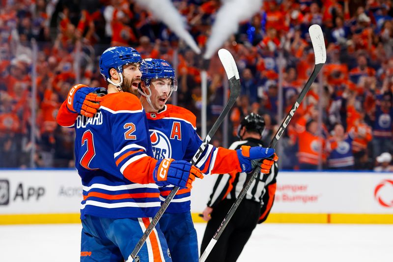 May 25, 2025; Edmonton, Alberta, CAN; Edmonton Oilers defenseman Evan Bouchard (2) and center Ryan Nugent-Hopkins (93) celebrates a goal scored by Bouchard against the Dallas Stars during the first period in game three of the Western Conference Final of the 2025 Stanley Cup Playoffs at Rogers Place. Mandatory Credit: Perry Nelson-Imagn Images