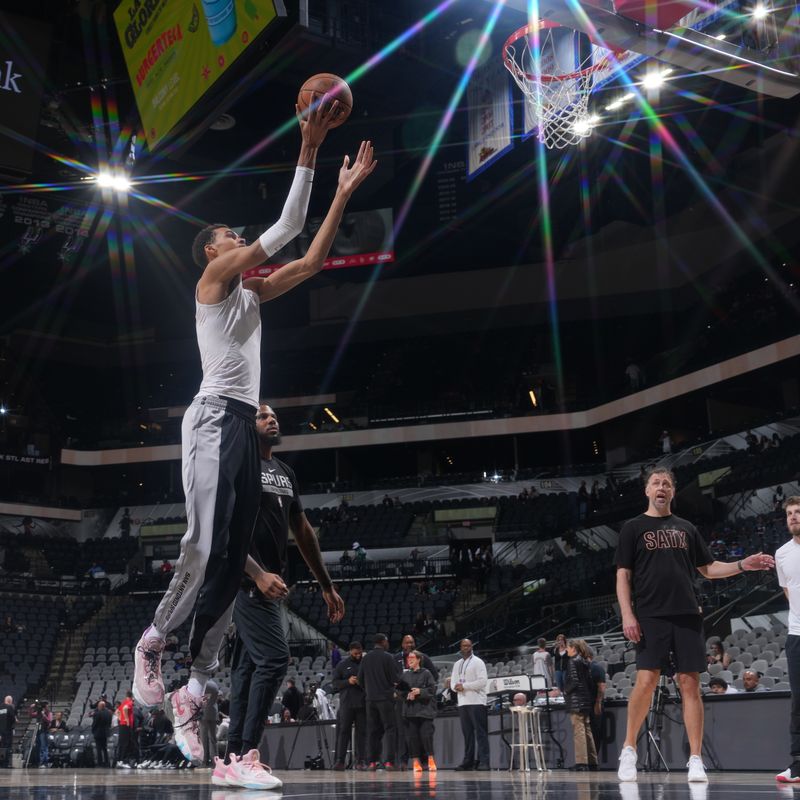 SAN ANTONIO, TX - MARCH 12: (EDITOR'S NOTE: This image was captured using a star filter) Victor Wembanyama #1 of the San Antonio Spurs warms up before the game against the Houston Rockets on March 12, 2024 at the Frost Bank Center in San Antonio, Texas. NOTE TO USER: User expressly acknowledges and agrees that, by downloading and or using this photograph, user is consenting to the terms and conditions of the Getty Images License Agreement. Mandatory Copyright Notice: Copyright 2024 NBAE (Photos by Jesse D. Garrabrant/NBAE via Getty Images)