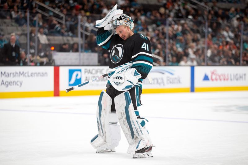 Oct 12, 2024; San Jose, California, USA; San Jose Sharks goaltender Vitek Vanecek (41) returns to the net following a timeout against the Anaheim Ducks during the second period at SAP Center at San Jose. Mandatory Credit: D. Ross Cameron-Imagn Images