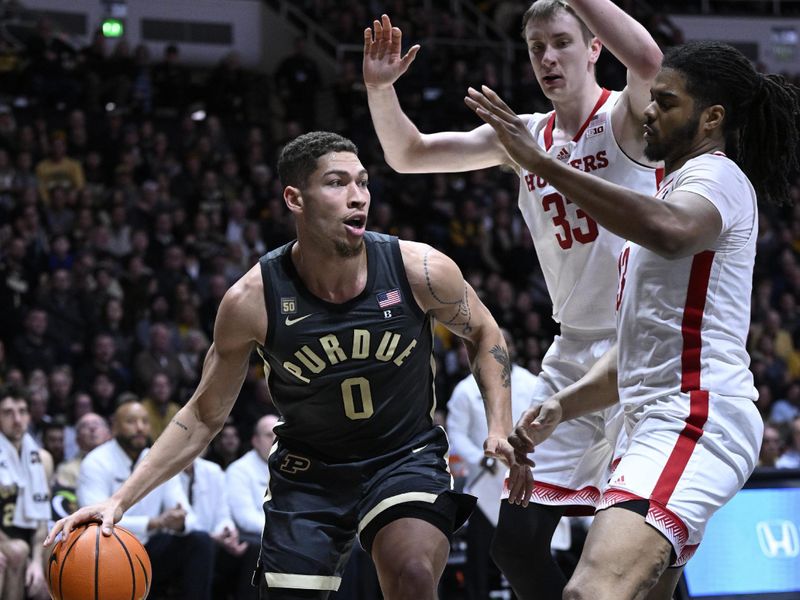 Jan 13, 2023; West Lafayette, Indiana, USA; Purdue Boilermakers forward Mason Gillis (0) looks for an open teammate around Nebraska Cornhuskers forward Derrick Walker (13) during the second half at Mackey Arena. Boilermakers won 73 to 55. Mandatory Credit: Marc Lebryk-USA TODAY Sports