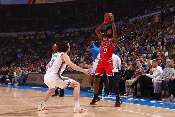 OKLAHOMA CITY, OK - NOVEMBER 22:  Coby White #0 of the Chicago Bulls handles the ball during the game against the Oklahoma City Thunder on November 22, 2023 at Paycom Arena in Oklahoma City, Oklahoma. NOTE TO USER: User expressly acknowledges and agrees that, by downloading and or using this photograph, User is consenting to the terms and conditions of the Getty Images License Agreement. Mandatory Copyright Notice: Copyright 2023 NBAE (Photo by Zach Beeker/NBAE via Getty Images)