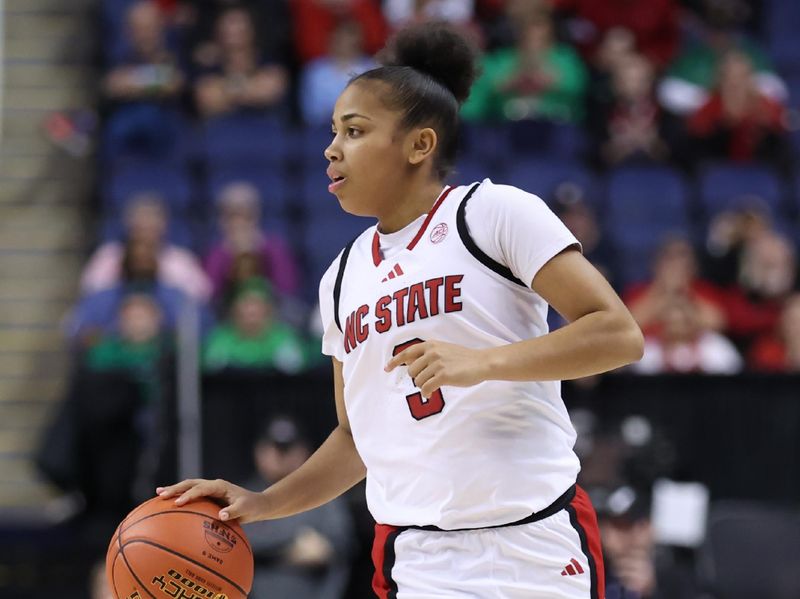 Mar 7, 2025; Greensboro, NC, USA;  NC State Wolfpack guard Zamareya Jones (3) dribbles the ball against Georgia Tech Yellow Jackets during the third quarter at First Horizon Coliseum. Mandatory Credit: Cory Knowlton-Imagn Images