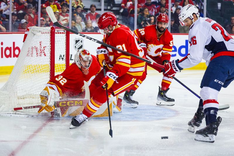 Mar 18, 2024; Calgary, Alberta, CAN; Calgary Flames goaltender Dustin Wolf (32) makes a save against the Washington Capitals during the first period at Scotiabank Saddledome. Mandatory Credit: Sergei Belski-USA TODAY Sports