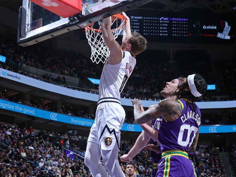 SALT LAKE CITY, UT - JANUARY 10: Christian Braun #0 of the Denver Nuggets dunks the ball during the game against the Utah Jazz on January 10, 2024 at Delta Center in Salt Lake City, Utah. NOTE TO USER: User expressly acknowledges and agrees that, by downloading and or using this Photograph, User is consenting to the terms and conditions of the Getty Images License Agreement. Mandatory Copyright Notice: Copyright 2024 NBAE (Photo by Melissa Majchrzak/NBAE via Getty Images)