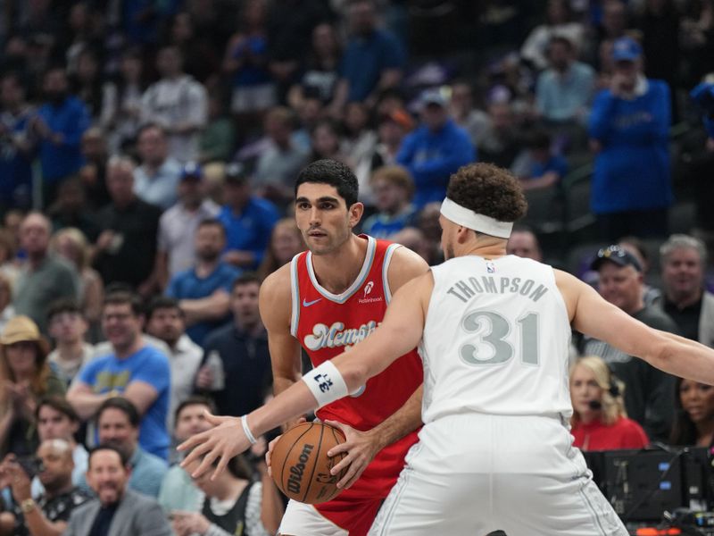 DALLAS, TX - MARCH 7: Santi Aldama #7 of the Memphis Grizzlies handles the ball during the game against the Dallas Mavericks on March 7, 2025 at American Airlines Center in Dallas, Texas. NOTE TO USER: User expressly acknowledges and agrees that, by downloading and or using this photograph, User is consenting to the terms and conditions of the Getty Images License Agreement. Mandatory Copyright Notice: Copyright 2025 NBAE (Photo by Glenn James/NBAE via Getty Images)