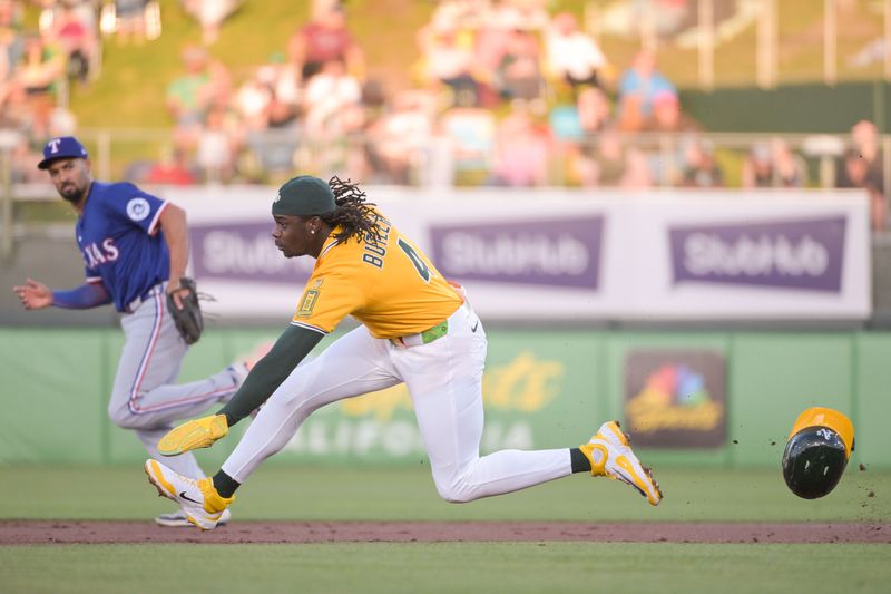 Apr 22, 2025; West Sacramento, California, USA; Athletics outfielder Lawrence Butler (4) attempts to steal second base during the first inning of the game against the Texas Rangers at Sutter Health Park. Mandatory Credit: Ed Szczepanski-Imagn Images