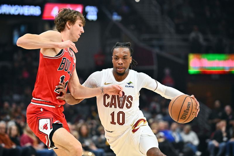 CLEVELAND, OHIO - OCTOBER 08: Darius Garland #10 of the Cleveland Cavaliers drives to the basket around Matas Buzelis #14 of the Chicago Bulls during the first half of a preseason game at Rocket Mortgage Fieldhouse on October 08, 2024 in Cleveland, Ohio. NOTE TO USER: User expressly acknowledges and agrees that, by downloading and or using this photograph, User is consenting to the terms and conditions of the Getty Images License Agreement. (Photo by Jason Miller/Getty Images)