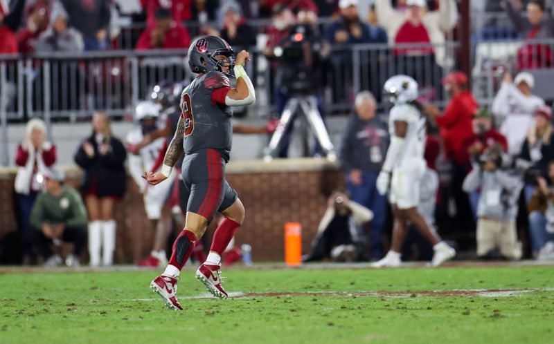 Nov 11, 2023; Norman, Oklahoma, USA; Oklahoma Sooners quarterback Dillon Gabriel (8) reacts after throwing a touchdown pass during the second quarter against the West Virginia Mountaineers at Gaylord Family-Oklahoma Memorial Stadium. Mandatory Credit: Kevin Jairaj-USA TODAY Sports