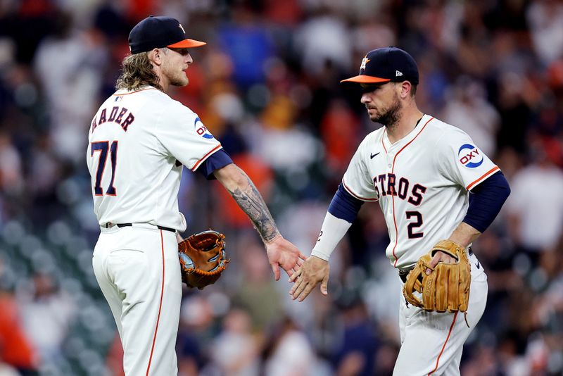 Jul 31, 2024; Houston, Texas, USA; Houston Astros relief pitcher Josh Hader (71) and third baseman Alex Bregman (2) congratulate each other following the final out against the Pittsburgh Pirates during the ninth inning at Minute Maid Park. Mandatory Credit: Erik Williams-USA TODAY Sports