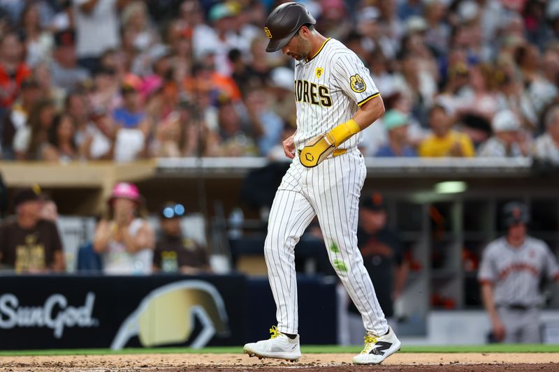 Sep 7, 2024; San Diego, California, USA; San Diego Padres third baseman Tyler Wade (14) scores on a single by designated hitter Luis Arraez (4) against the San Francisco Giants during the fifth inning at Petco Park. Mandatory Credit: Chadd Cady-Imagn Images