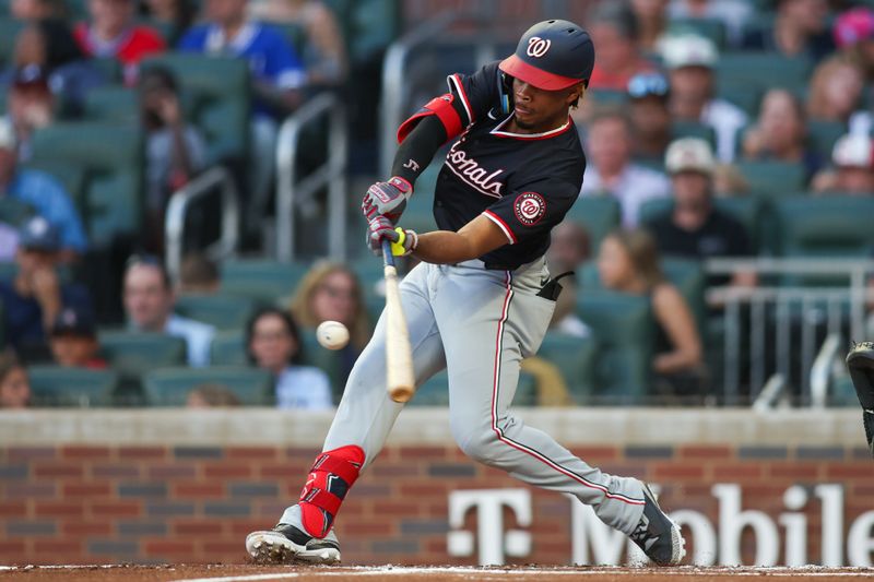 Aug 24, 2024; Atlanta, Georgia, USA; Washington Nationals third baseman Jose Tena (8) hits a two-run home run against the Atlanta Braves in the second inning at Truist Park. Mandatory Credit: Brett Davis-USA TODAY Sports