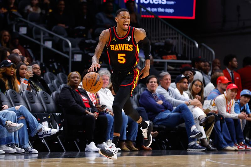 ATLANTA, GEORGIA - FEBRUARY 23: Dejounte Murray #5 of the Atlanta Hawks drives down the court during the first quarter against the Toronto Raptors at State Farm Arena on February 23, 2024 in Atlanta, Georgia. NOTE TO USER: User expressly acknowledges and agrees that, by downloading and or using this photograph, User is consenting to the terms and conditions of the Getty Images License Agreement. (Photo by Todd Kirkland/Getty Images)