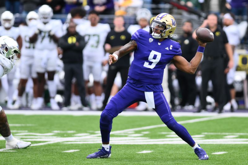 Oct 14, 2023; Seattle, Washington, USA; Washington Huskies quarterback Michael Penix Jr. (9) passes the ball against the Oregon Ducks during the first half at Alaska Airlines Field at Husky Stadium. Mandatory Credit: Steven Bisig-USA TODAY Sports