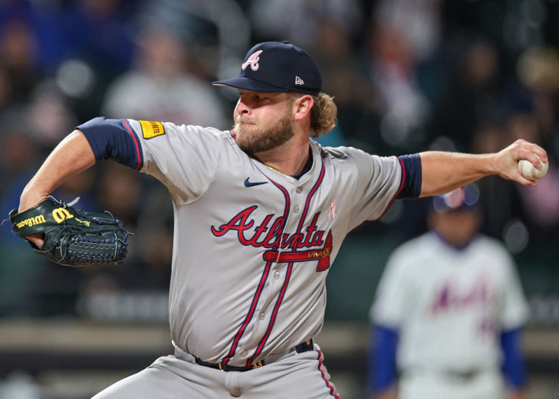 May 12, 2024; New York City, New York, USA; Atlanta Braves relief pitcher A.J. Minter (33) delivers a pitch during the ninth inning against the New York Mets at Citi Field. Mandatory Credit: Vincent Carchietta-USA TODAY Sports