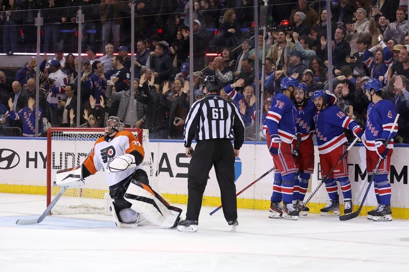 Mar 26, 2024; New York, New York, USA; New York Rangers center Vincent Trocheck (16) celebrates his goal against Philadelphia Flyers goaltender Samuel Ersson (33) with defenseman K'Andre Miller (79) and center Mika Zibanejad (93) and defenseman Braden Schneider (4) during the third period at Madison Square Garden. Mandatory Credit: Brad Penner-USA TODAY Sports