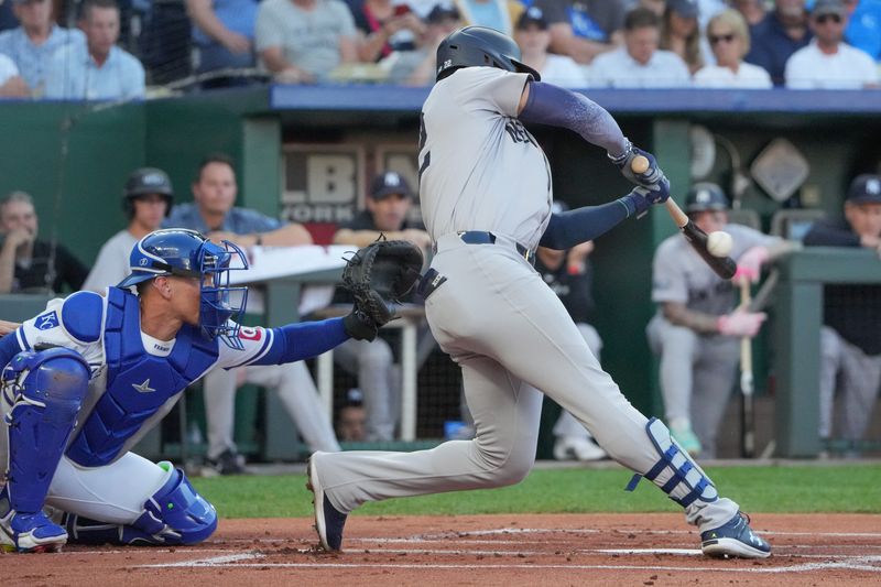 Jun 10, 2024; Kansas City, Missouri, USA; New York Yankees designated hitter Juan Soto (22) hits a single against the Kansas City Royals in the first inning at Kauffman Stadium. Mandatory Credit: Denny Medley-USA TODAY Sports