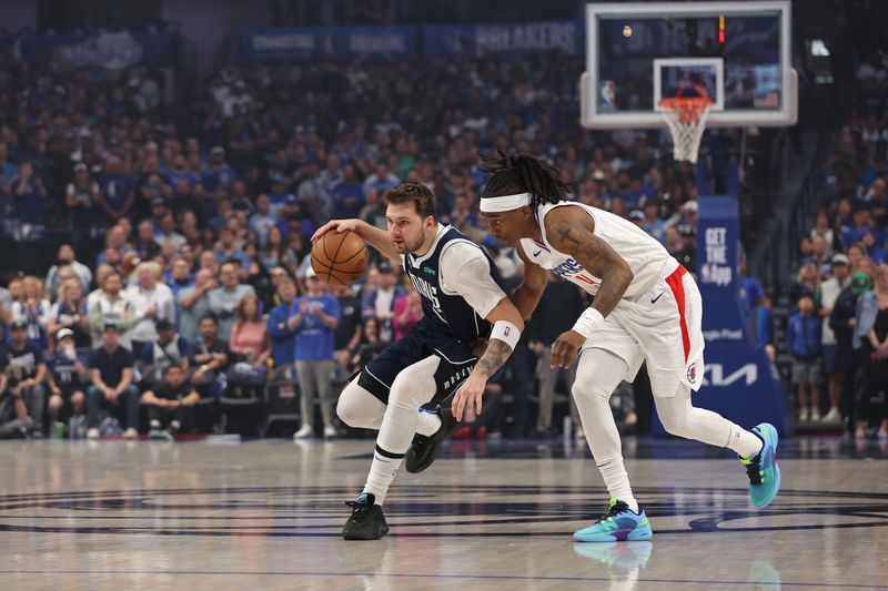 DALLAS, TX - APRIL 28: Luka Doncic #77 of the Dallas Mavericks dribbles the ball during the game against the LA Clippers  during Round 1 Game 4 of the 2024 NBA Playoffs on April 28, 2024 at the American Airlines Center in Dallas, Texas. NOTE TO USER: User expressly acknowledges and agrees that, by downloading and or using this photograph, User is consenting to the terms and conditions of the Getty Images License Agreement. Mandatory Copyright Notice: Copyright 2024 NBAE (Photo by Tim Heitman/NBAE via Getty Images)