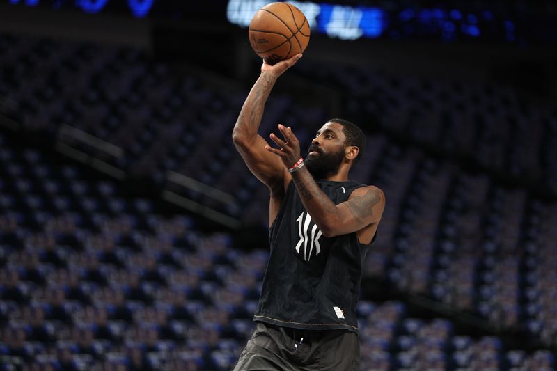 DALLAS, TX - April 26:  Kyrie Irving #11 of the Dallas Mavericks warms up before the game against LA Clippers during Round 1 Game 3 of the 2024 NBA Playoffs on April 26, 2024 at the American Airlines Center in Dallas, Texas. NOTE TO USER: User expressly acknowledges and agrees that, by downloading and or using this photograph, User is consenting to the terms and conditions of the Getty Images License Agreement. Mandatory Copyright Notice: Copyright 2024 NBAE (Photo by Tim Heitman/NBAE via Getty Images)