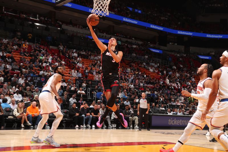 MIAMI, FL - OCTOBER 30: Pelle Larsson #9 of the Miami Heat  shoots the ball during the game shoots the ball during the game against the New York Knicks on October 30, 2024 at Kaseya Center in Miami, Florida. NOTE TO USER: User expressly acknowledges and agrees that, by downloading and or using this Photograph, user is consenting to the terms and conditions of the Getty Images License Agreement. Mandatory Copyright Notice: Copyright 2024 NBAE (Photo by Issac Baldizon/NBAE via Getty Images)