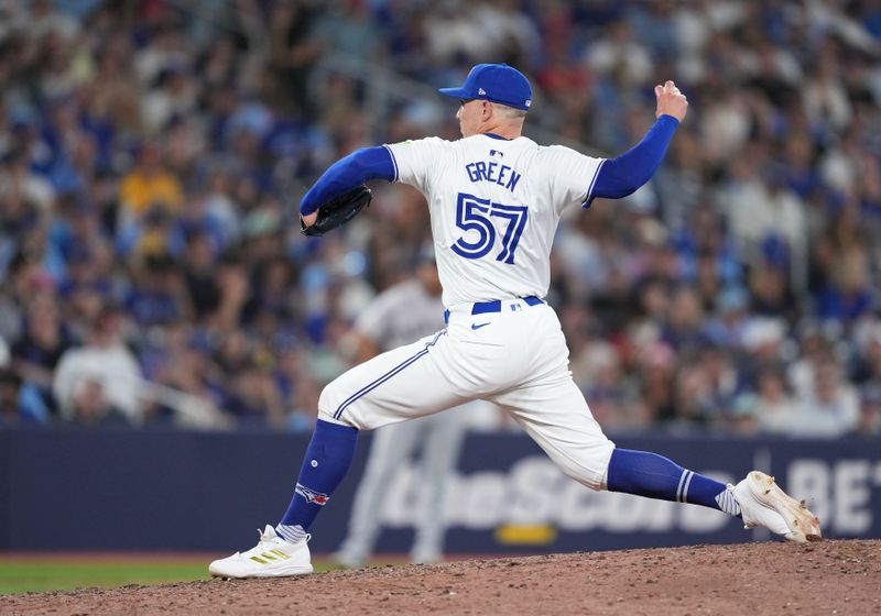 Jun 30, 2024; Toronto, Ontario, CAN; Toronto Blue Jays relief pitcher Chad Green (57) throws pitch against the New York Yankees during the eighth inning at Rogers Centre. Mandatory Credit: Nick Turchiaro-USA TODAY Sports