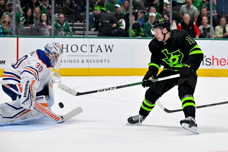 Apr 3, 2024; Dallas, Texas, USA; Edmonton Oilers goaltender Calvin Pickard (30) stops a shot by Dallas Stars center Logan Stankoven (11) during the second period at the American Airlines Center. Mandatory Credit: Jerome Miron-USA TODAY Sports